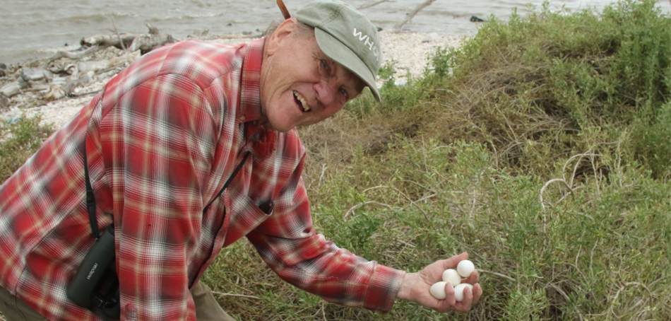 Dr. Frank Rohwer's brother holding eggs
