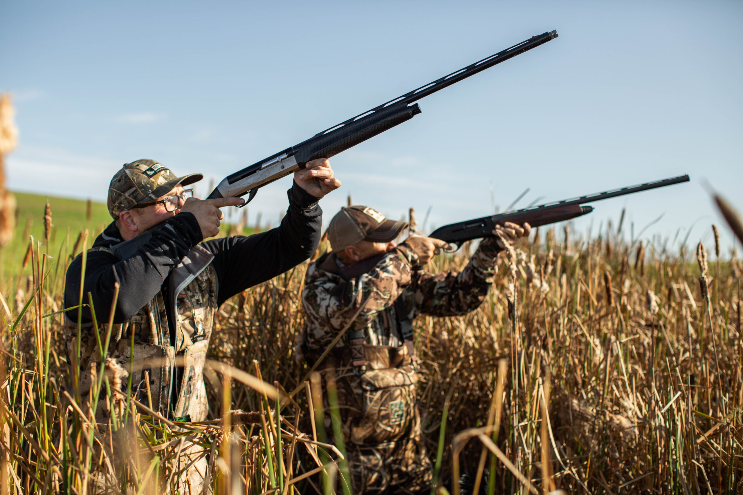 Hunters set to shoot in a field. Delta Waterfowl urges Oregon waterfowlers to make their voices heard on Ballot Measure 114—a threat to the future of hunting and hunter-funded conservation.