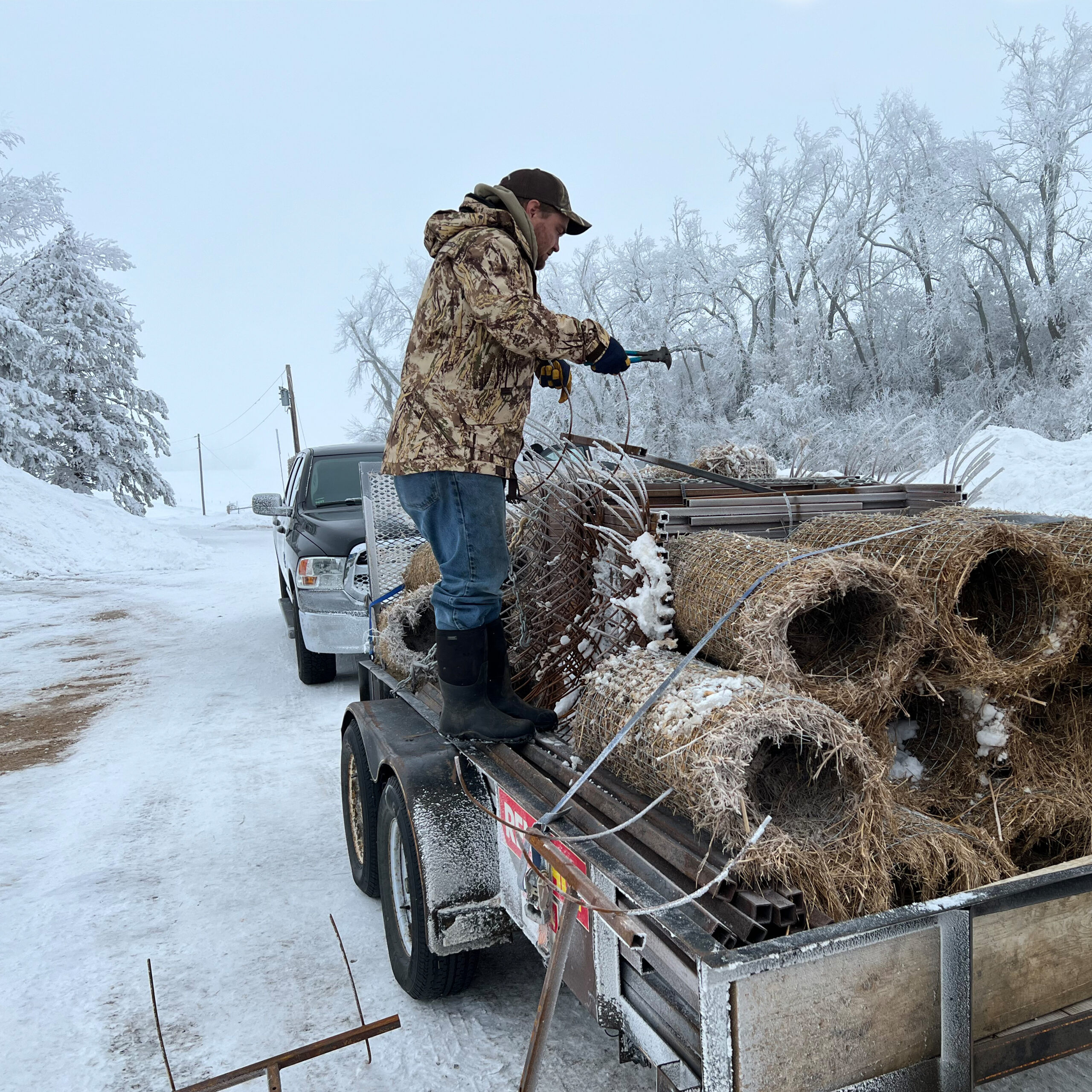 A Delta Waterfowl Hen House operative begins to unload the materials to assemble one of many new Hen Houses in South Dakota.