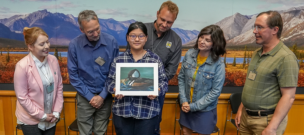 2023 National Junior Duck Stamp Art Contest Winner Mila Linyue Tong, 15, and judges.