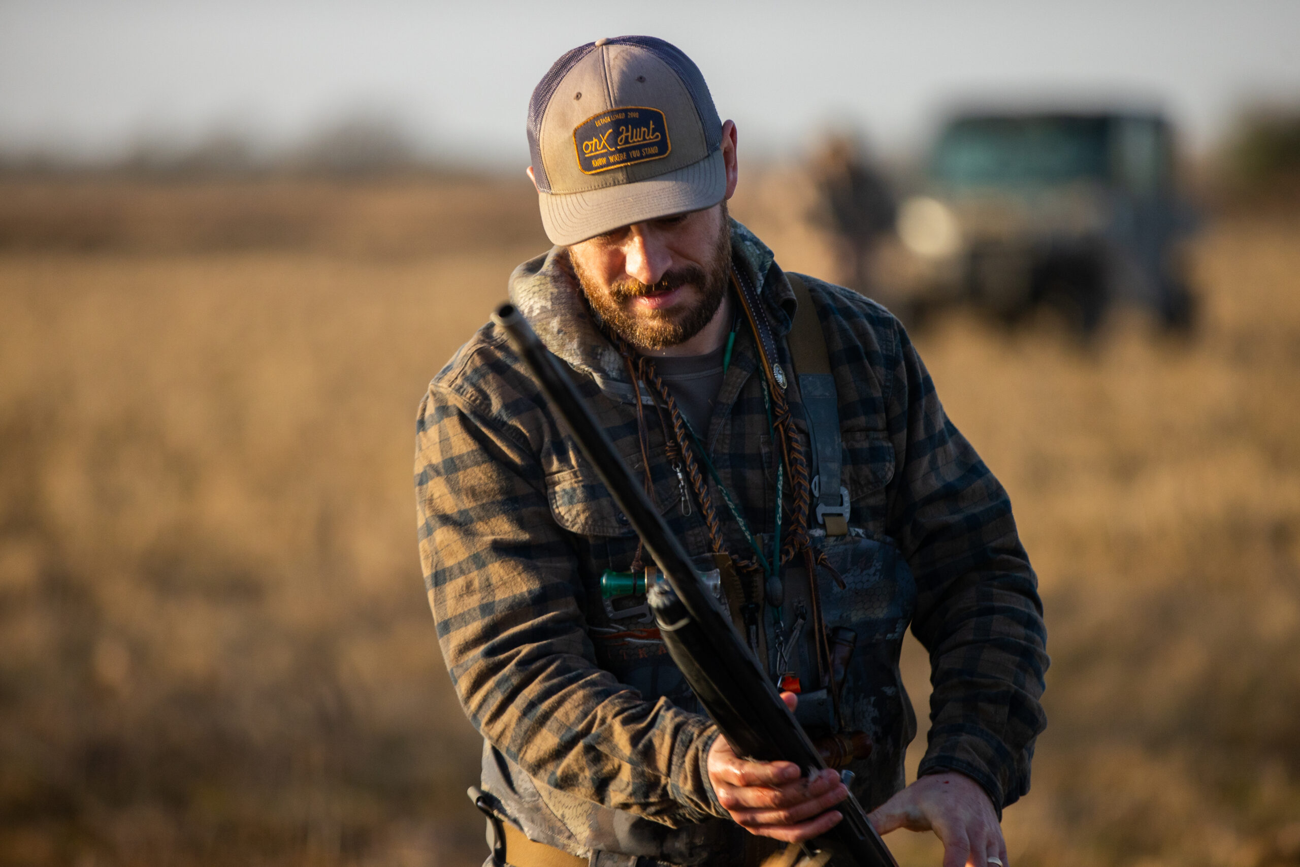A Duck hunter holds his gun during a hunt.