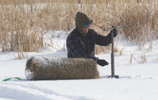 One of Delta Waterfowl's hen houses is being installed in the snow on the PPR.