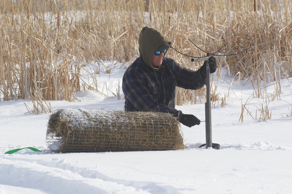 One of Delta Waterfowl's hen houses is being installed in the snow on the PPR.
